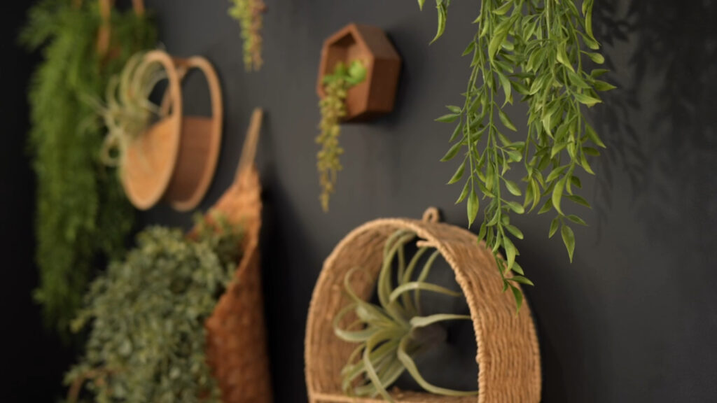 A wall in the Raven salon showing greenery and baskets